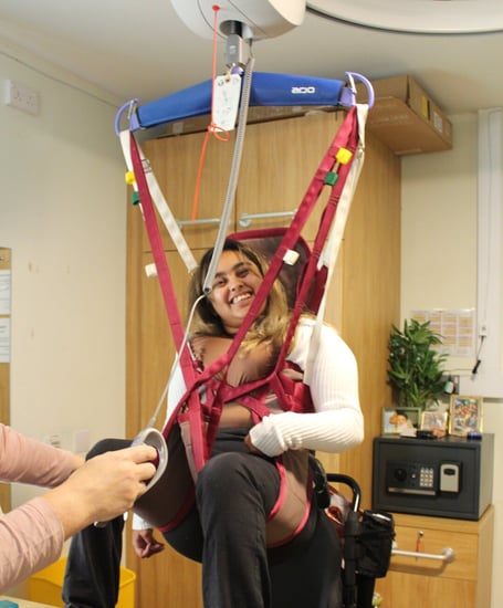 Student Amirah gets a lift in a hoist, Treloar's, December 2024.