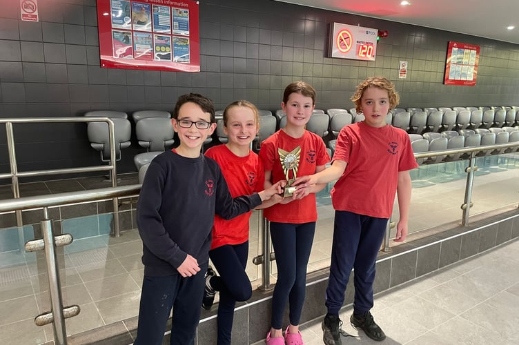 Children from St Mary's Bentworth Primary School with the smaller schools division trophy, Alton primary schools swimming gala, Alton Sports Centre, January 16th 2025.