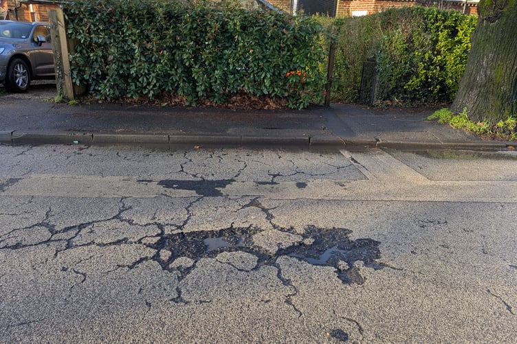 A potholed road in Farnham.