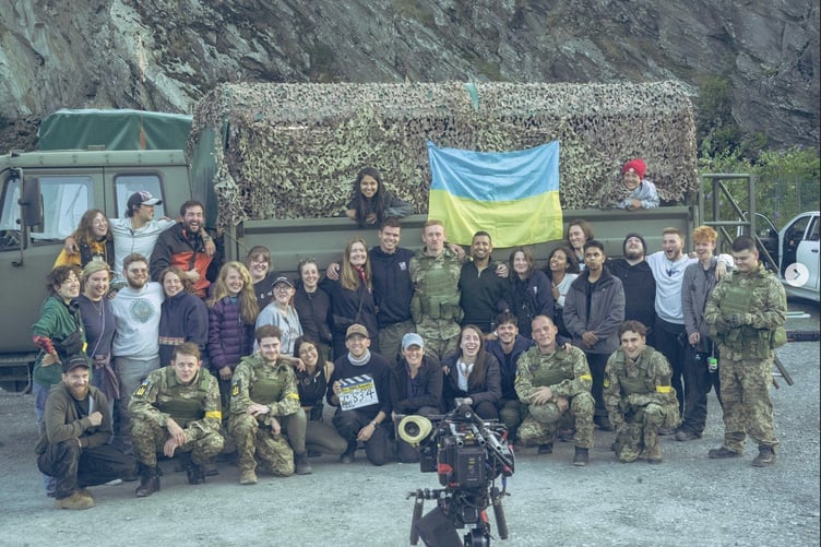 Luke Predeth in black and orange jacket on the far left, with Rock, Paper, Scissors crew