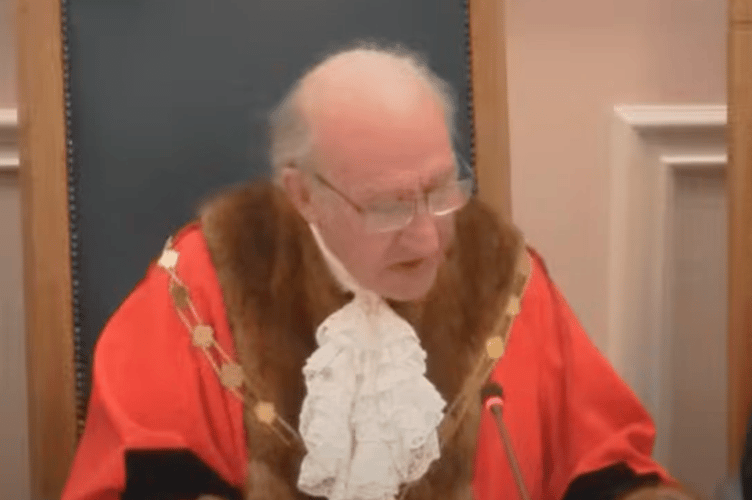 Cllr John Ward leads budget discussions at a meeting of Waverley Borough Council on February 25, 2025.