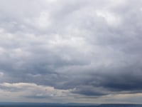 Partly cloudy skies today turning overcast tomorrow with low rain