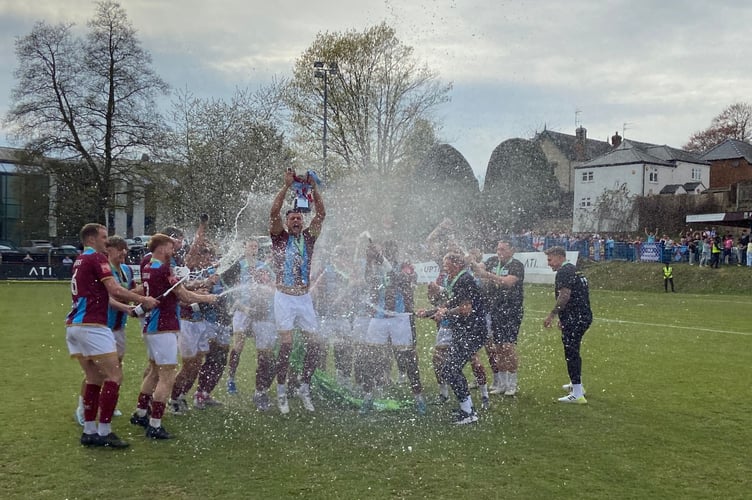 Farnham Town skipper Ryan Kinnane lifts the Isthmian League South Central Division title