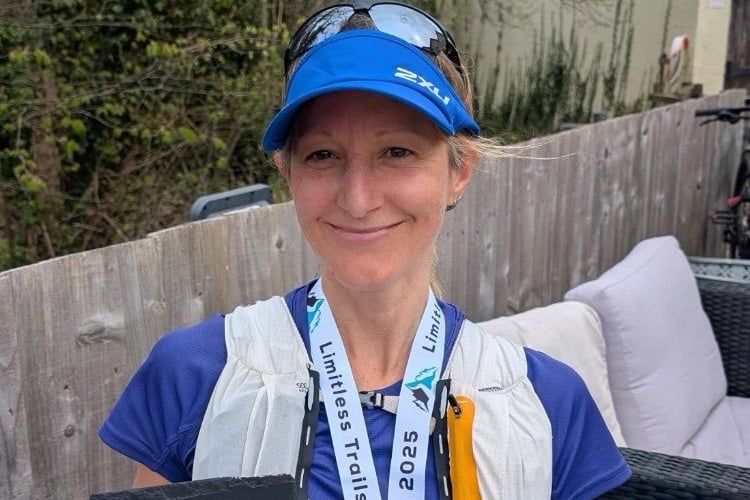 Sarah Smith with her medal and award for third place at the Beast of the Brecons race