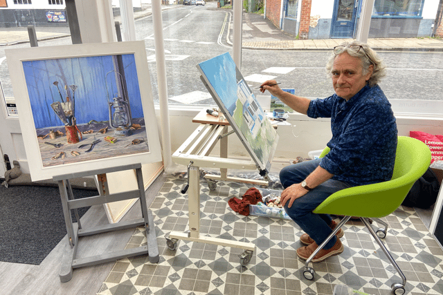 Coastal scene under creation by Tim Burns' paintbrush in Alton gallery