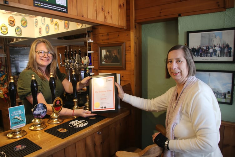 Shirley Hawley presents the East Hants CAMRA Pub of the Year 2025 award to Chloe Watson, The Railway Arms, Anstey Road, Alton, April 26th 2025.
