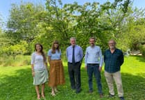 MP Damian Hinds makes friends with moths at Chawton travel agents Naturetrek