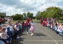 Flags, fun and flair at Badshot Lea Village Infant School's VE Day 80 party