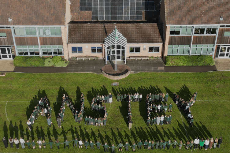 Anstey Junior School pupils spell out the school's name on the playing field.