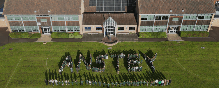 Anstey Junior School pupils spell out the school's name on the playing field.