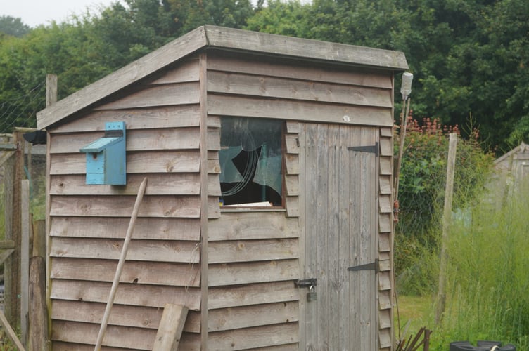 Smashed shed window in Wrecclesham