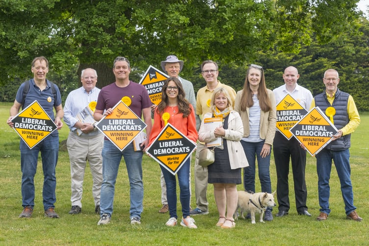 Farnham campaigner Theresa Meredith-Hardy, centre, joins fellow local Liberal Democrats in celebrating the extension of free school meals to more children.