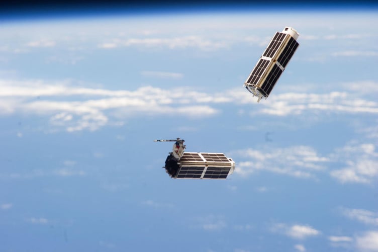 File photo of a set of NanoRacks CubeSats photographed by an Expedition 38 crew member after the deployment by the Small Satellite Orbital Deployer (SSOD), 11 Feb 2014.         British researchers are working to solve the problem of Elon Musk's reflective satellites - by painting them black. A new partnership between Surrey NanoSystems and the University of Surrey is aiming to tackle the growing problem, a major concern for astronomers worldwide. Their latest innovation, Vantablack 310, is a super-black coating designed to dramatically reduce the glare from satellites that interferes with astronomical observations. Only 2% of incoming light is reflected by the surface after product is applied, while the remaining 98% is absorbed. More than 8,000 low Earth orbit (LEO) satellites already orbit Earth and projections estimate a rise to 60,000 by 2030, partly driven by the development of mega-constellations.