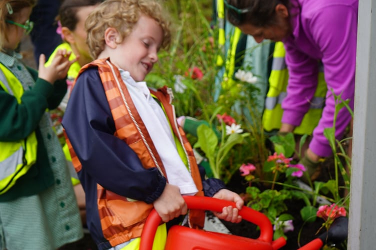 Pupil watering plants