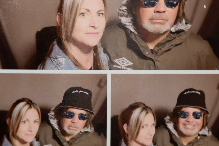 Collect picture of John Smallbones with wife Elaine before a concert in November 2019. See SWNS story SWOCoasis; Meet the Oasis superfan who has spent THOUSANDS on band memoribillia including life size cut outs of the Gallagher brothers - and his fiancee isn't even a fan. John Smallbones, 45, fell in love with the band back in 1992 and was devastated when the brothers went their separate ways. Over the past decade, window surveyor John has spent thousands of pounds on Oasis merchandise including vinyls, clothing and life size cutouts of both Gallagher brothers. He's even got Oasis tattoos and has named his business 'Wall of Glass' after the popular 2017 Liam Gallagher hit with a van plastered in stickers dedicated to the boys. His home is covered top to bottom with Oasis memorabilia, much to the amusement of his extremely patient fiancee Elaine, 46, who isn't even a fan of the band.