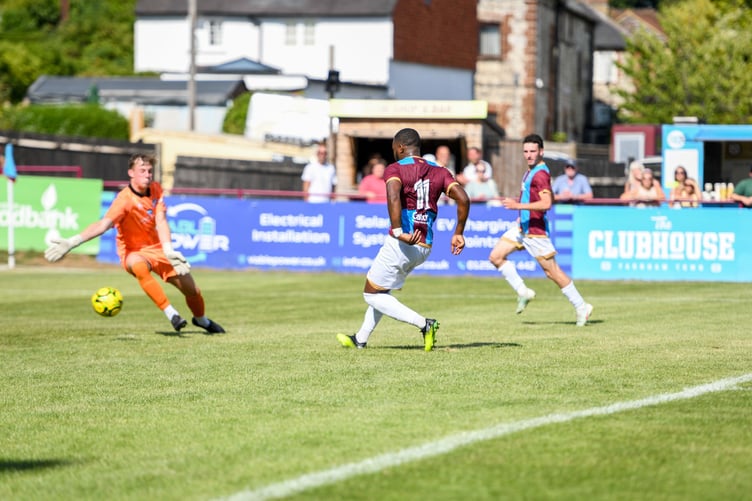 Ogo Obi scores Farnham's third goal against Eastbourne Borough