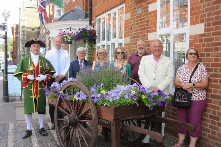 Dignitaries with the floral display outside Farnham Town Council HQ.