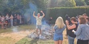 WATCH: Fundraisers conquer fire walk for dementia charity