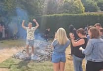 WATCH: Fundraisers conquer fire walk for dementia charity