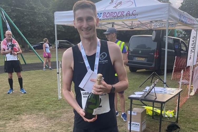 Marcus Etheridge triumphant after winning the race