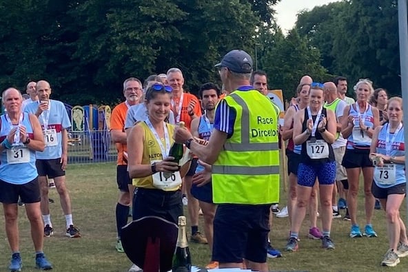 Race director Stephen Sutton presents Rachel Walsh with the first lady prize
