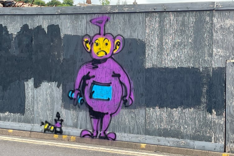 Teletubby graffiti on the hoardings outside the Woolmead site in Farnham.