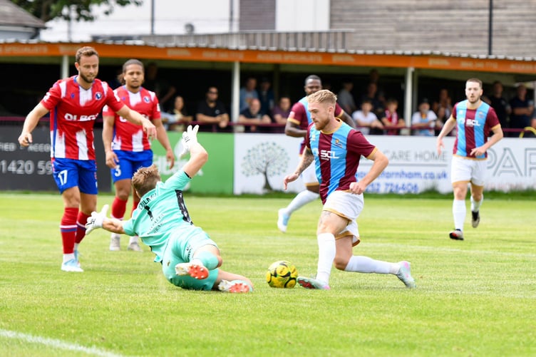 Bobby-Joe Taylor rounds Dorking keeper Harrison Foulkes before scoring Farnham's equaliser