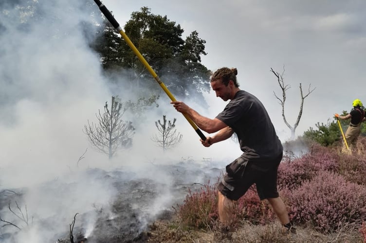 Oscar Powell from The Sculpture Park helping to put our fire on The Jumps, Churt