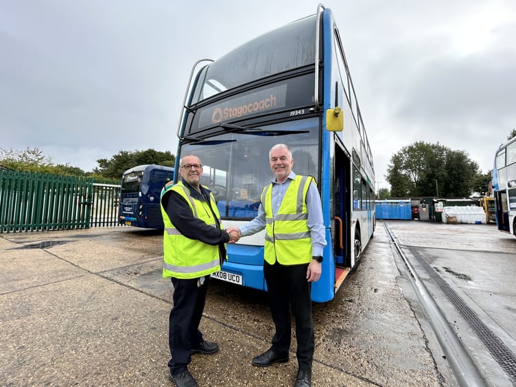 Tim Restall, shakes hands with Graham Harmer, Operations Manager at Stagecoach South