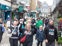 One man's feet as town goes marching on Together for Kev