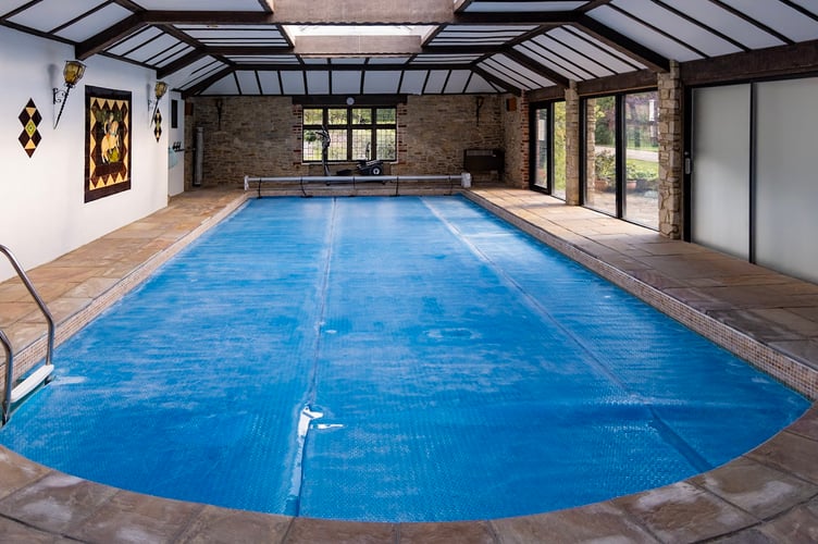 The pool at Great Tangley Manor in Wonersh, Surrey. // The owners of a manor believed to be the oldest continuously inhabited property in Britain are selling up - because the maintenance has become too much. It is thought that Great Tangley Manor in Wonersh, Surrey has had residents since 1016 - more than a millienium ago. Anne Powell-Evans, 79, and her husband Glyn bought the house almost 30 years ago after being âdrawn inâ by the iconic history and the âbeautiful gardensâ. Having acquired records of everyone who has inhabited the home since 1016, the owners feel they can confidently claim it as the oldest constantly lived-in home in the nation.