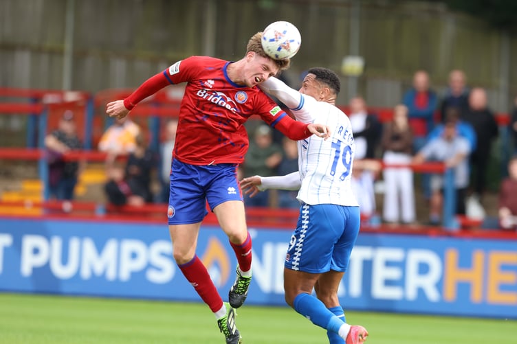 Charlie Penman wins a header during Aldershot Town's 1-0 win against Hartlepool United (Photo: Ian Morsman)
