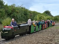 First train on extended miniature railway line at Ropley station