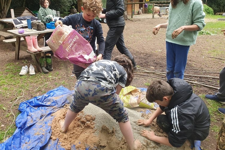 Creating a clay oven at Huckleberries.