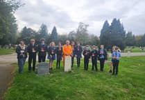 Pupils from Amery Hill School help historian clean Alton's war graves