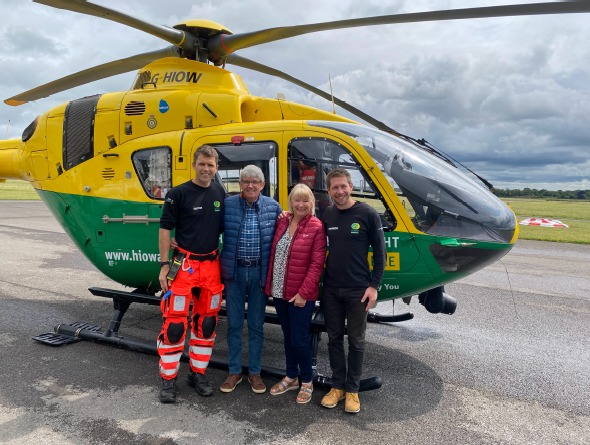 Ian and Jackie Jurd with the Hampshire and Isle of Wight Air Ambulance crew who helped save his life, November 2025.