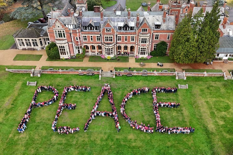 Frensham Heights students form the word Peace to mark Remembrance Day.