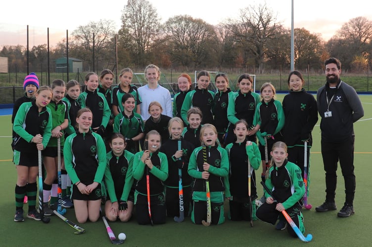 Highfield and Brookham girls get hands-on hockey tips from Olympic medallist Ellie Rayer.
