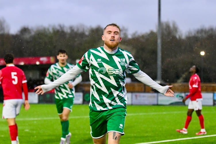 Bobby-Joe Taylor celebrates after scoring Farnham Town's opening goal