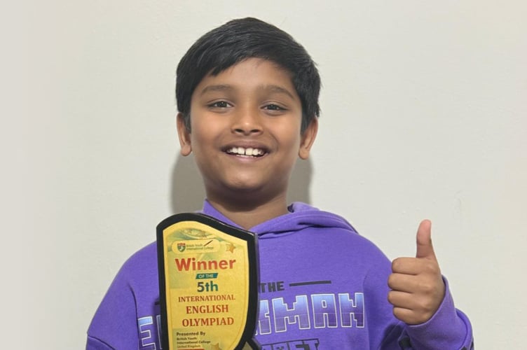 Riaan Bonnyson Macwan shows off his International English Olympiad trophy, December 3rd 2025.