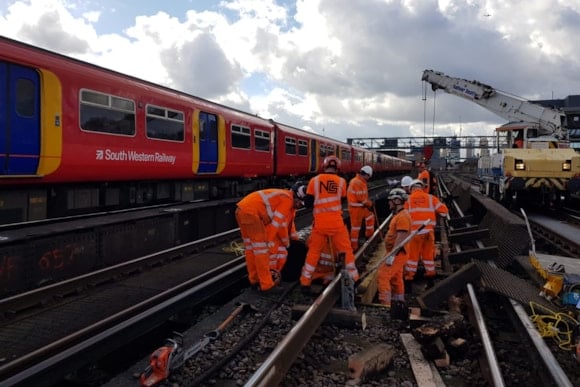 Engineers working a South Western Railway track.