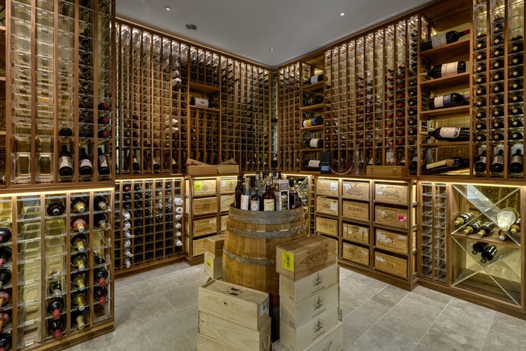 Downley House in South Downs National Park, near Petersfield, Hampshire. A house that was featured on Grand Designs has had to slash its price by a whopping £750,000 after failing to sell for 18 months.Downley House was listed for sale in July 2024 with a guide price of £5 million when owner Chris Taee decided it was time to sell up after 12 years in the property.Taee built the 7,374 sq ft oak-clad house from scratch, which boasts five bedrooms - three in the family wing and two guest bedrooms - five bathrooms and an oval-shaped central dining area with a 23ft high ceiling.The house was used by Kevin McCloud to host the Grand Designs House of the Year show there, whilst also being shortlisted for the RIBA House of the Year award.The property is built on 2.5 acres within a valley of South Downs National Park, near Petersfield, Hampshire.