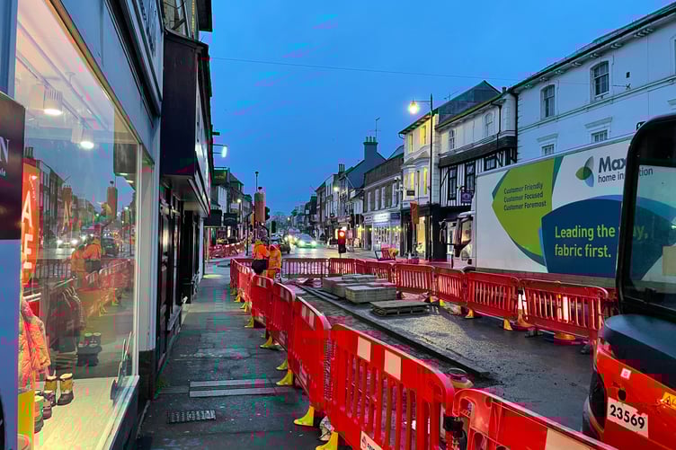 Workers removing the rain gardens in Farnham town centre.