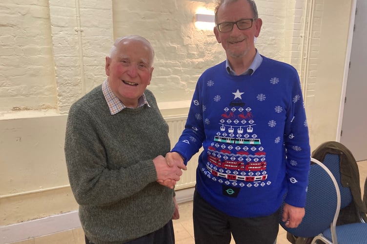 Allan Chick hands over the chairmanship of Alton Town Guided Walks to Paul Ebbutt, December 2025.