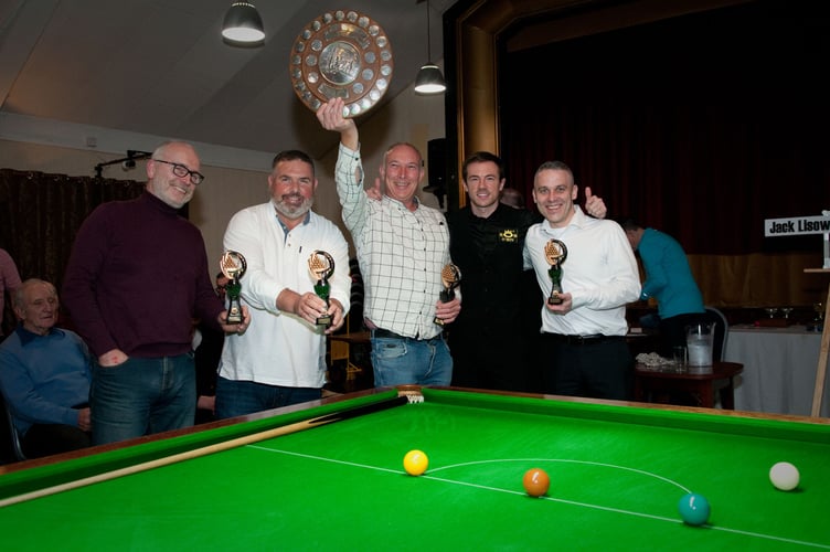 Ian Etherington (centre, holding trophy) made a 59 break for new Division Two leaders Comrades A (Photo: Tim Hudson)