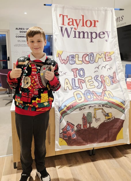 Oliver Murrell with his winning design in a Taylor Wimpey flag design competition, January 20th 2026.