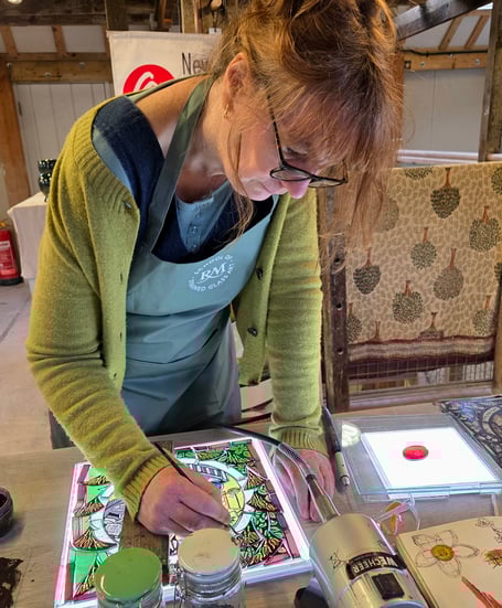 Rachel Mulligan works on a stained glass panel in Farnham.