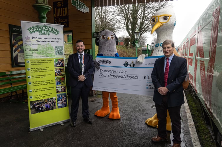 South Western Railway ambassadors Wes and Sandy present a cheque for £4,000 to the Watercress Line, February 27th 2026.