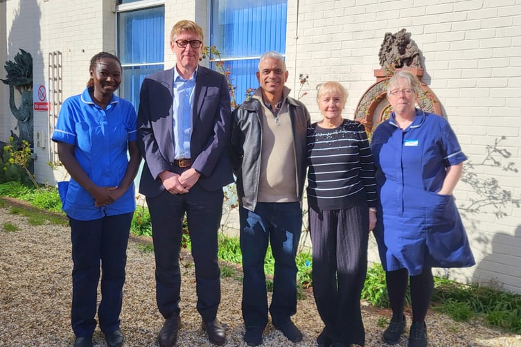Hampshire Hospitals staff, including Consultant Urologist Dr Richard Hindley, with research trial patient Wayne Prosper following his prostate cancer treatment.