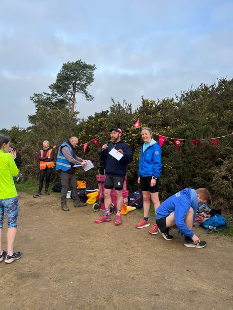 Haslemere Border Young Athletes coaches promoting the new club at Hogmoor Parkrun